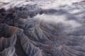 Blue-gray bentonite ridges and deep shadowed gullies in Utah badlands.