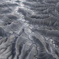 Red and turquoise mineral ridges converge dramatically across Utah badlands.