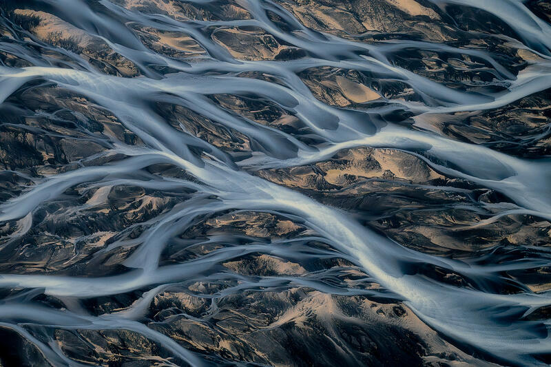 raided glacial rivers flowing toward the Atlantic Ocean across Iceland's volcanic coastline.