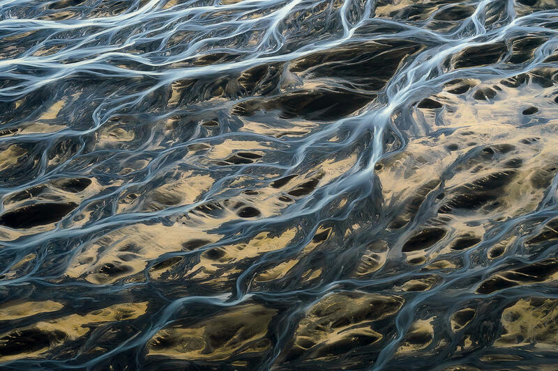 Golden volcanic sands and glacial rivers combine to create an intricate living network across Iceland.
