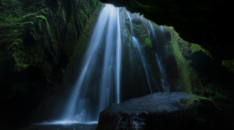 Gljúfrabúi Waterfall pours through a hidden moss-covered canyon in one of Iceland's most magical landscapes.