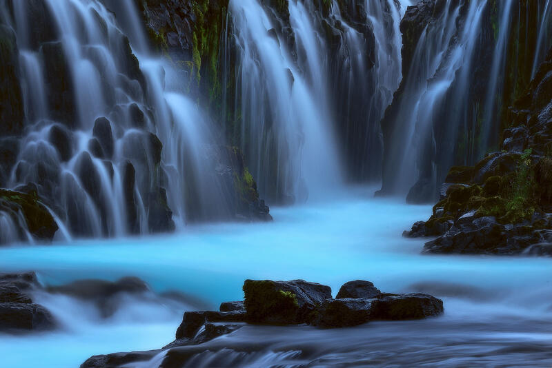 A hidden cathedral of basalt columns and luminous blue water where Iceland's volcanic landscape feels timeless.
