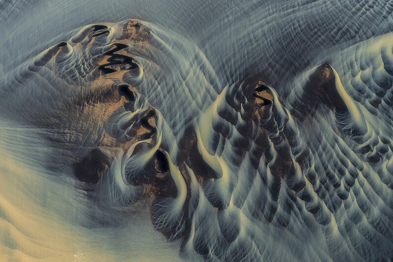 Abstract volcanic formations reveal Iceland's landscape as a work of natural sculpture.