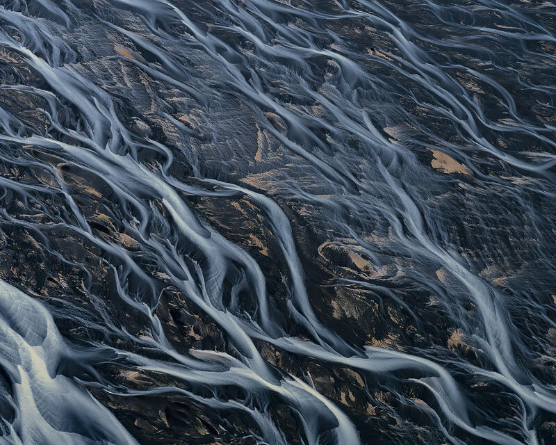 Silver glacial rivers spread across Iceland like the lifeblood of the landscape.