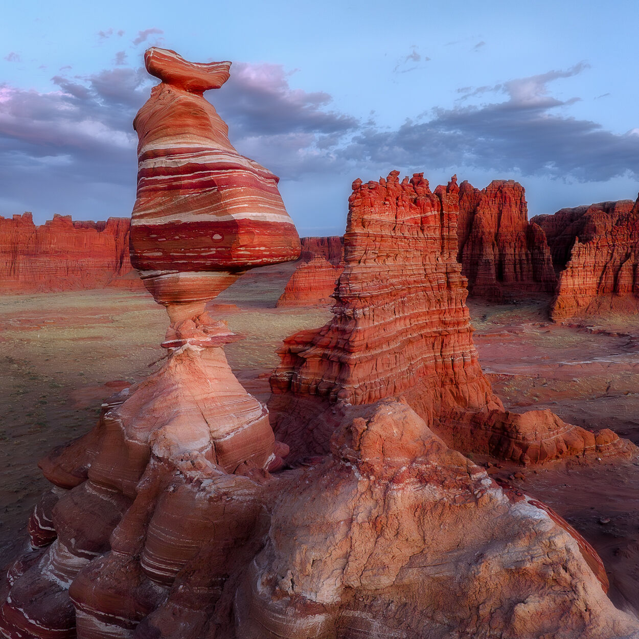Desert Dancer A wonderfully improbable sandstone formation rises above the desert, balancing stripes, curves, and a touch of geological mischief...