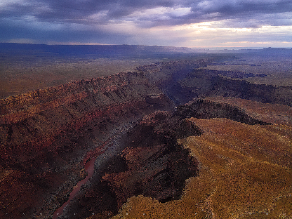 The mighty Colorado River is revealed, deep below the desert rim; and beginning to carve a a beautiful journey into the Grand...