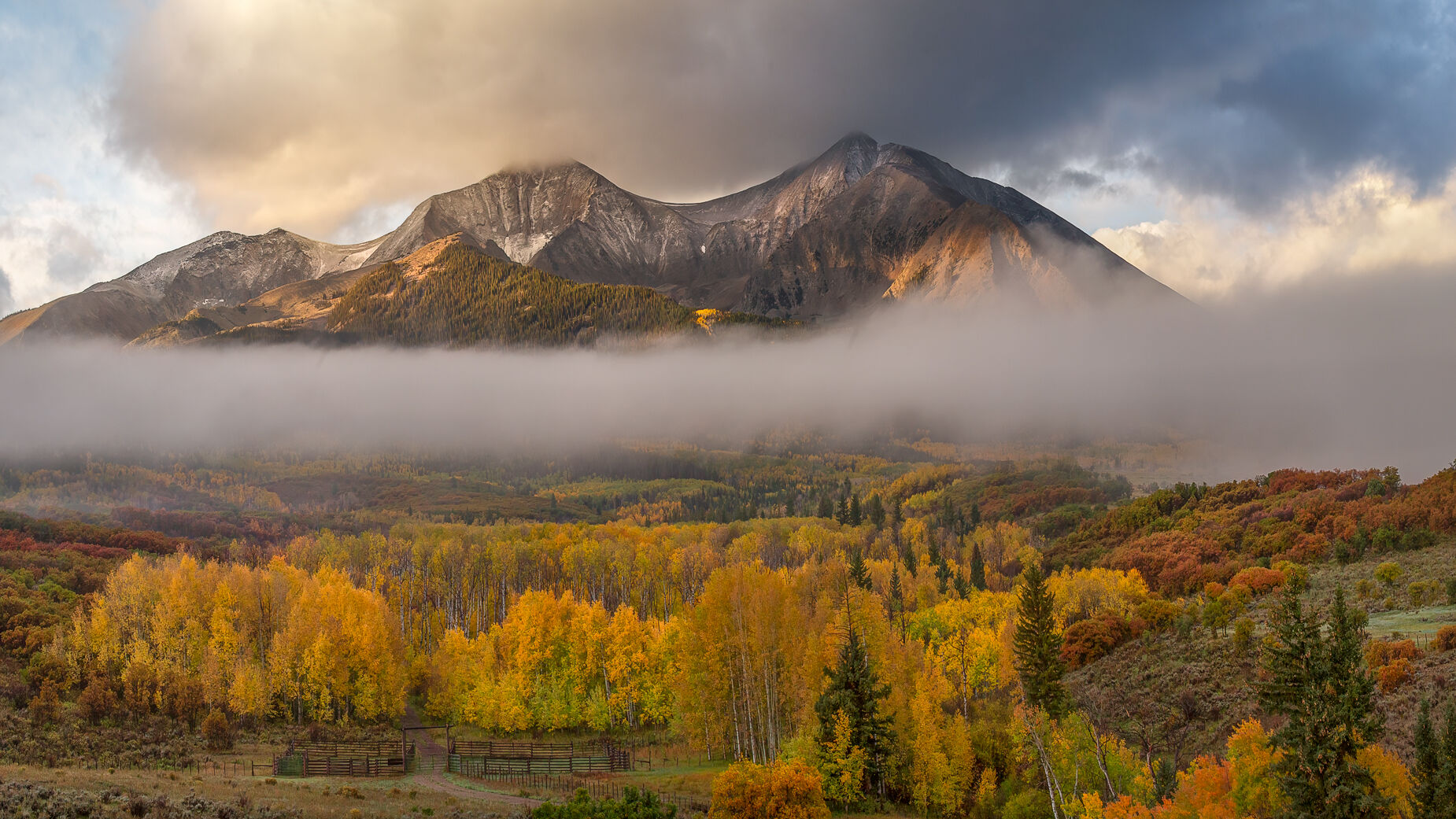 Sopris Revealed Autumn color spreads across a mount Sopris, Colorado as drifting fog wraps the landscape beneath. Breaking light illuminates...