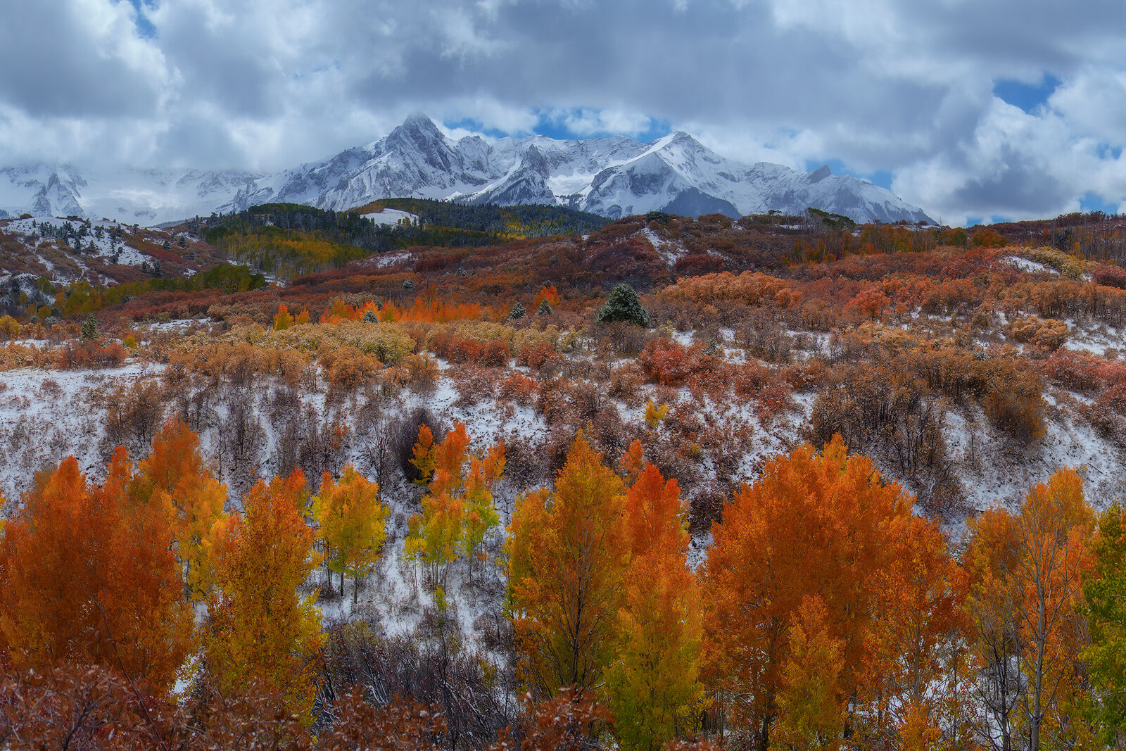 A fresh coating of snow, brilliant mid afternoon light accentuate the stunning fall color.